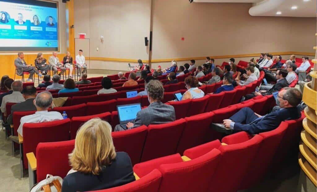 Audience members watch a panel discussion at the 2022 Chemical Ventures Conference hosted at the Innovation Space